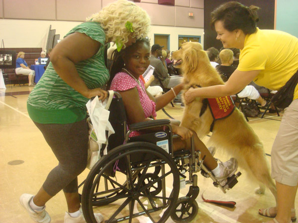 CFC therapy dog, Skipper with Lisa visit with kids - photo courtesy of Canines for Christ